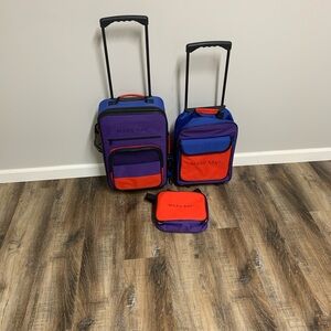 Mary Kay 3-Piece Travel Set in Purple, Red and Blue.